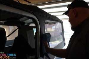 Wiping the Jeep windows clean after one spray with the Clear View Plastic & Glass Cleaner. They're clean and smooth! photo by Lynnette at TheFunTImesGuide.com clear-view-plastic-cleaner-after