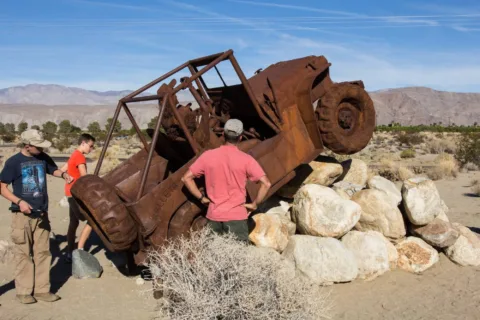 Examining the rust on this old Jeep statue. 