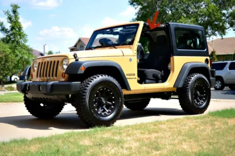 Jeep Wrangler with the doors off. See our tips to keep the dome light off (where the red arrow is). 