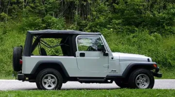 2004 Jeep Wrangler Unlimited parked in the green grass of Gatlinburg, Tennessee.