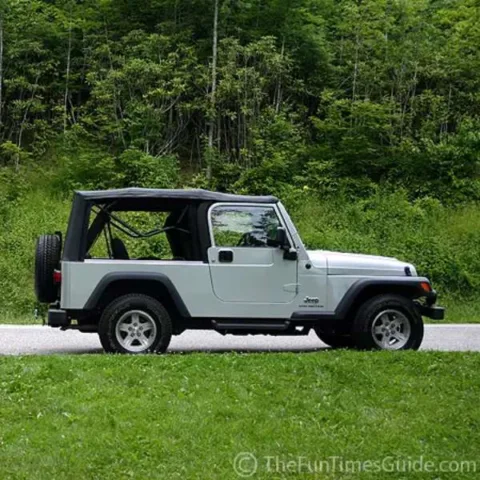 2004 Jeep Wrangler Unlimited parked in the green grass of Gatlinburg, Tennessee.