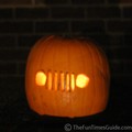 A Jeep Wrangler grille lit on Halloween night.