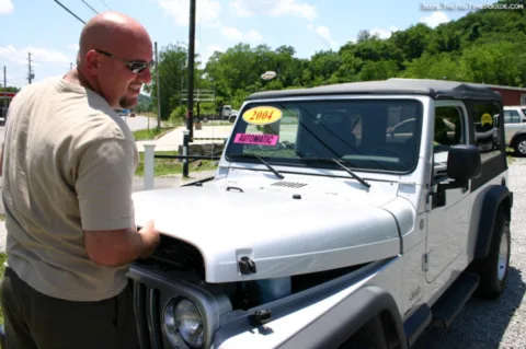 Jim checking out the 2004 Jeep Wrangler Unlimited before we drove it off the lot.