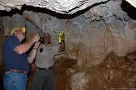 aruba-guide-using-flashlight-in-cave.jpg